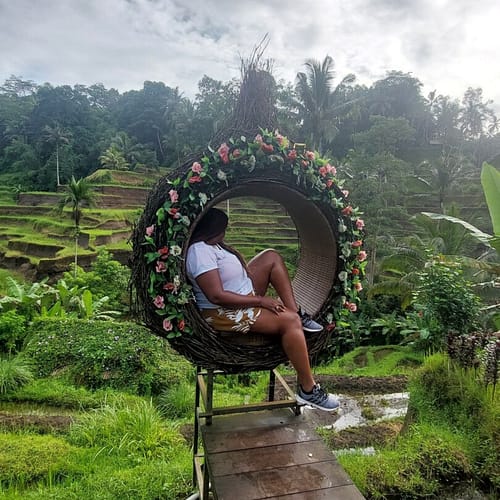Myself overlooking the rice fields from a beautiful seating area during my Bali Indonesia trip. 