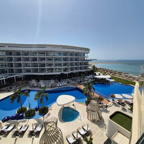 pool and exterior view of the St. Regis Muscat.