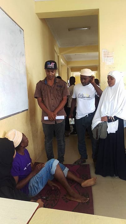 Students performing a drama in their classroom for me.